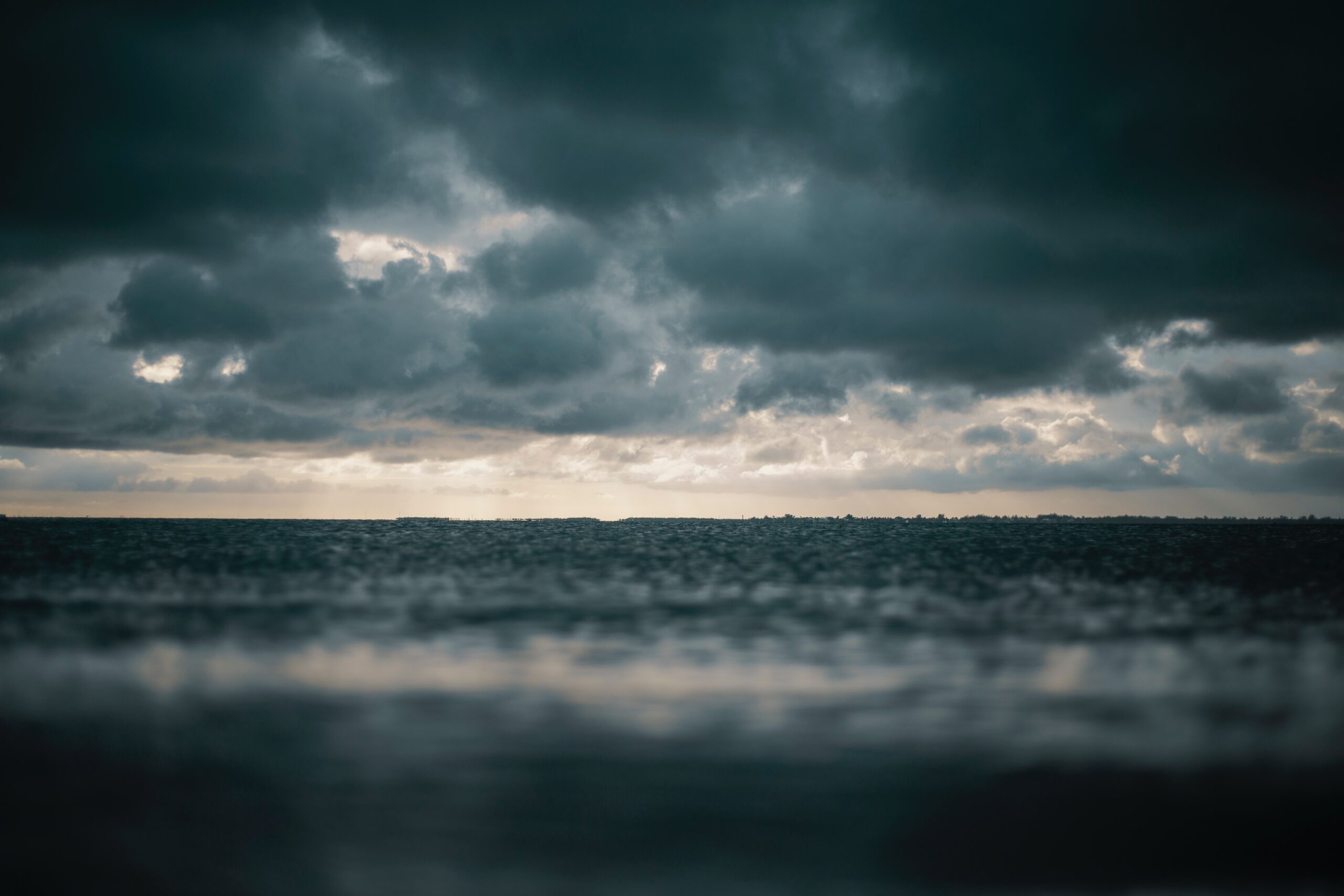 beach-clouds-dark-1154510-scaled